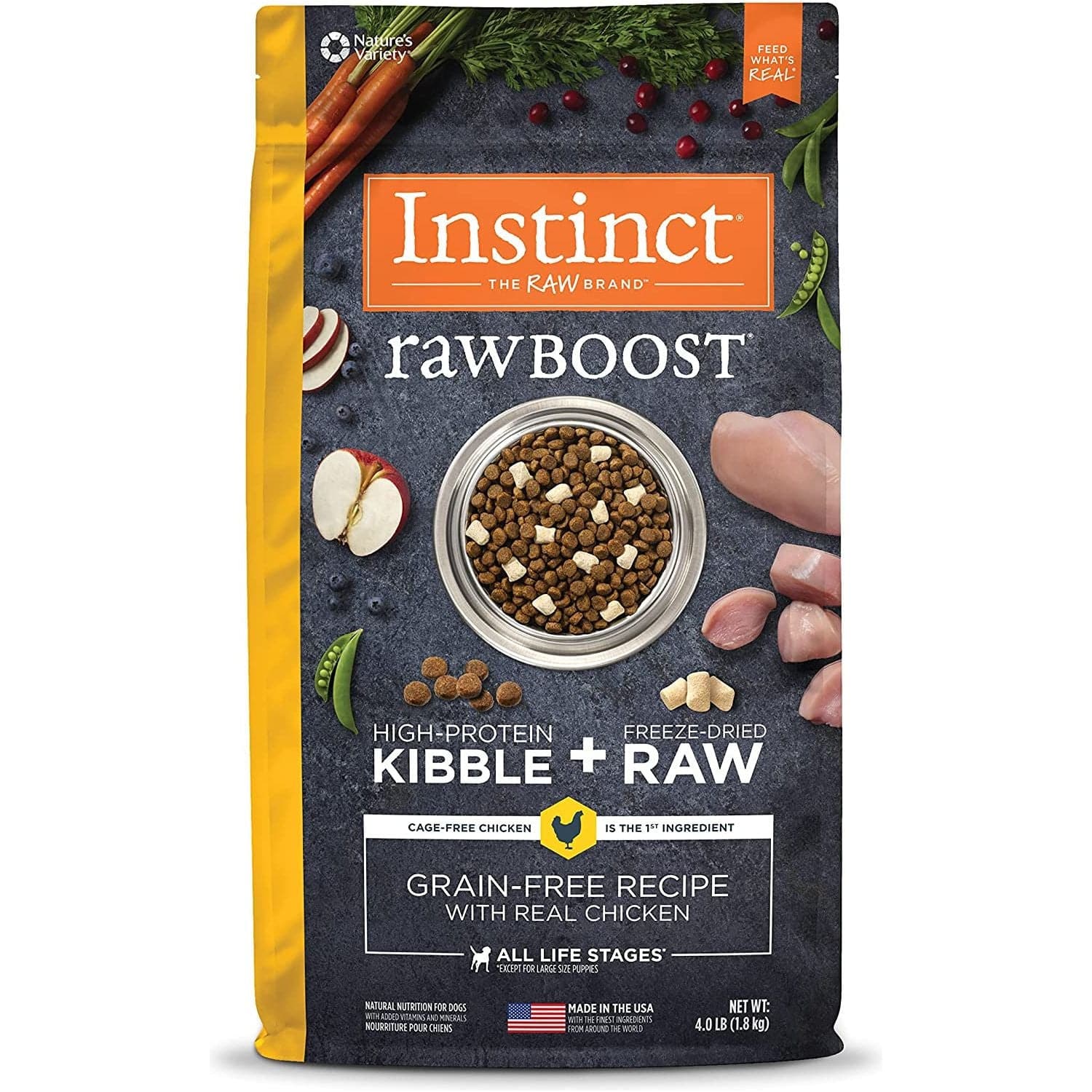 A package of Instinct RawBoost high-protein kibble for dogs, featuring freeze-dried raw chicken. The package is orange and grey, highlighting its grain-free recipe and suitability for all life stages, with decorations of raw vegetables and chicken pieces around a bowl of kibble.