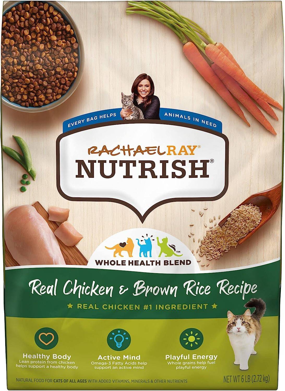 A bag of Rachael Ray Nutrish Whole Health Blend with Real Chicken & Veggies Recipe natural food for adult dogs is displayed against a wooden background. The packaging features images of sliced chicken, carrots, peas, and grains to represent the ingredients. It promotes healthy minds with active nutrients and balanced energy through whole grains. The label on the package states that every bag helps animals in need.