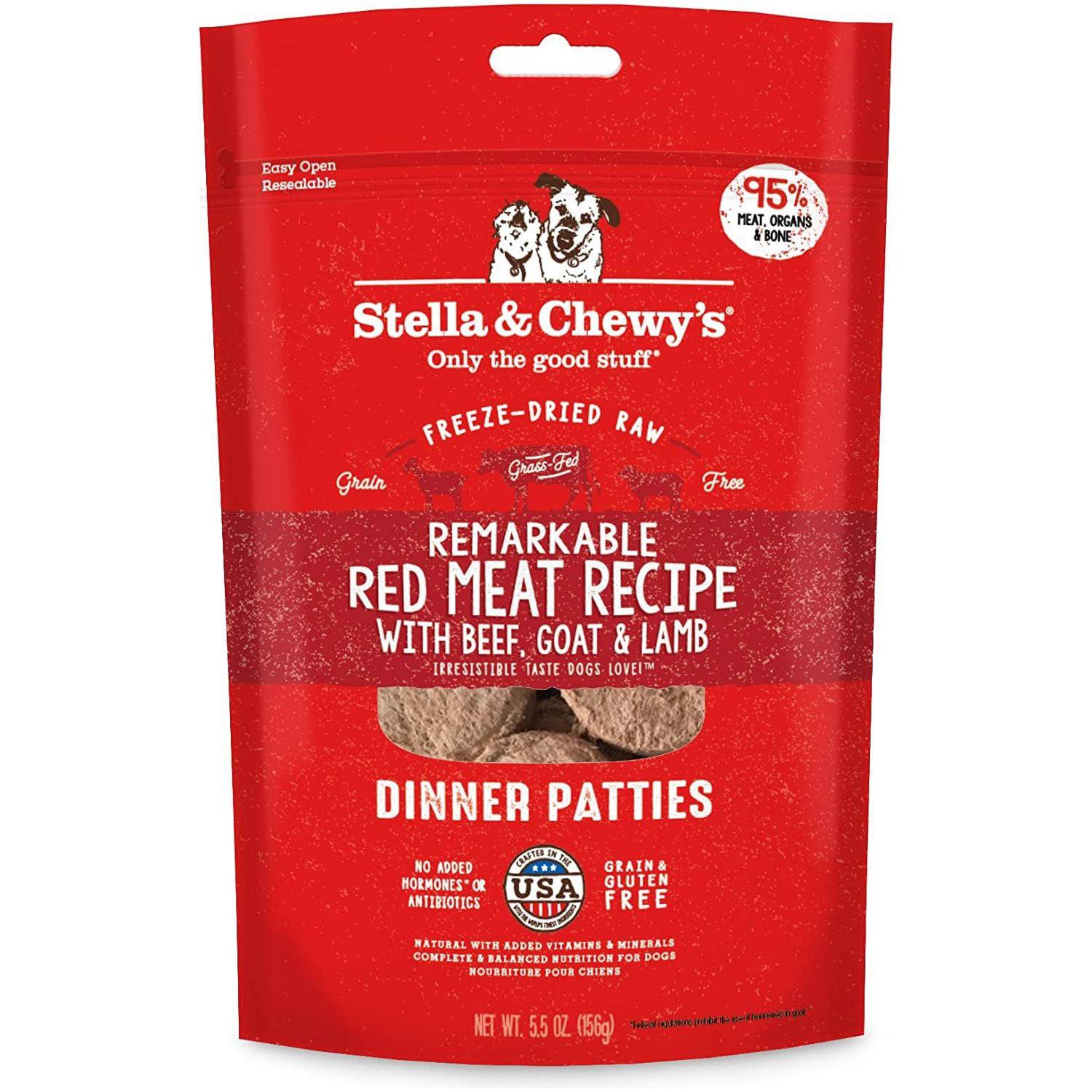 A red packet of Stella & Chewy's freeze-dried raw dog food, featuring a Remarkable Red Meat Recipe with beef, goat, and lamb. The package has an image of two dogs and highlights that the product contains 95% meat, organs, and bone, is grain and gluten-free, and has no added hormones or antibiotics. The net weight is 5.5 oz (156g).