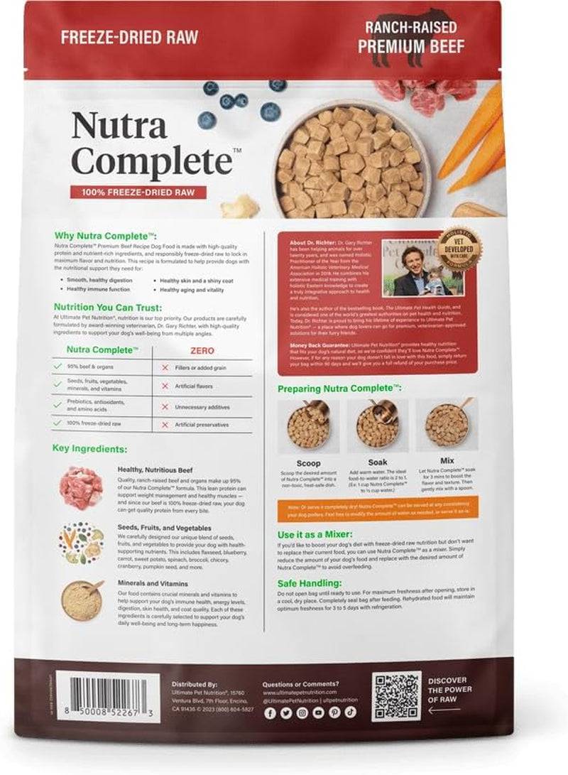 A bag of Ultimate Pet Nutra Complete Freeze-Dried Raw premium beef dog food, highlighting 100% freeze-dried raw ingredients and no fillers or artificial preservatives, offering a rich source of beef, seeds, fruits, vegetables, minerals, and vitamins for dogs. Instructions for preparing the food by scooping, soaking, and mixing are included on the back of the bag, along with nutritional information and company contact details.