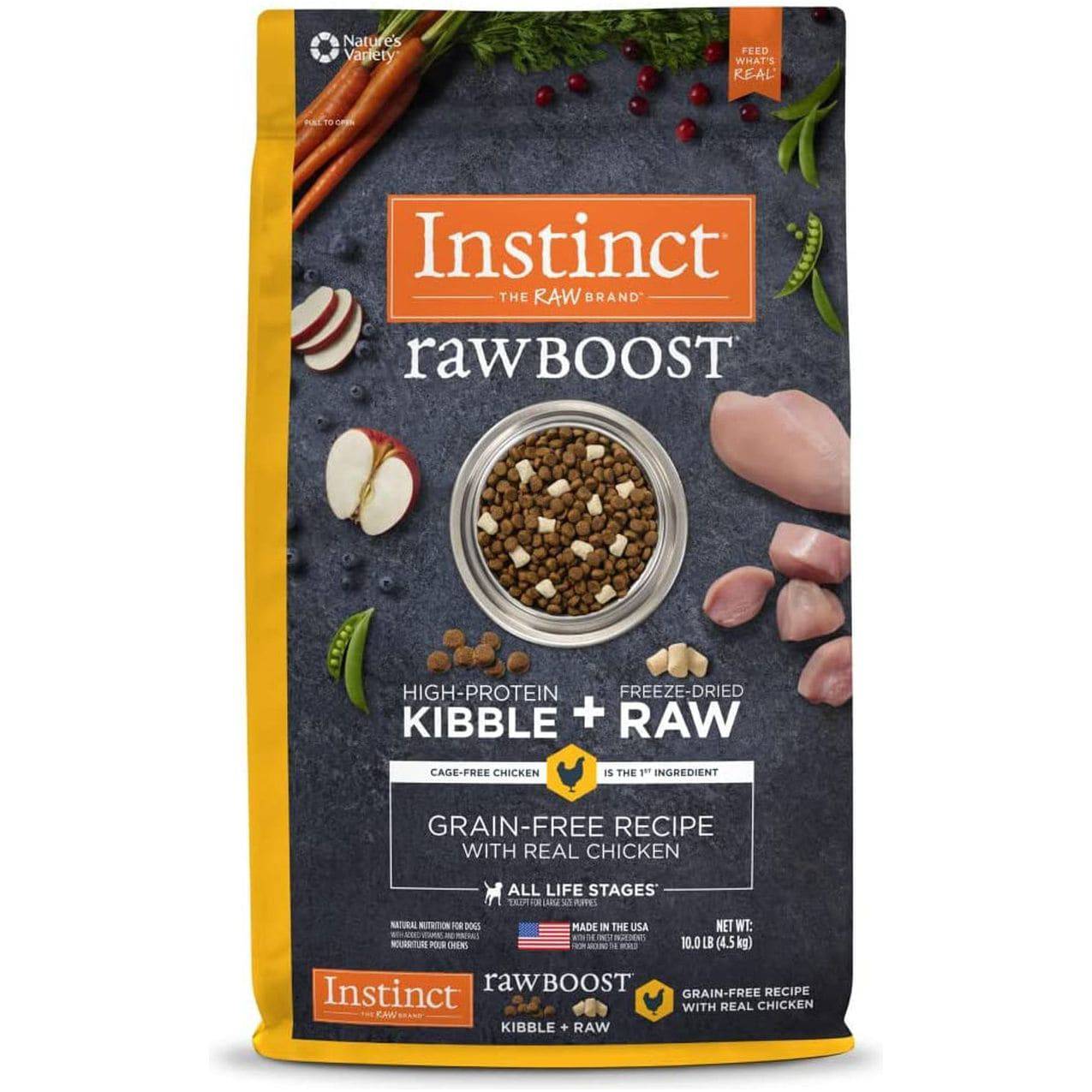 Package of Instinct Raw Boost high-protein, grain-free dog food with kibble and freeze-dried raw chicken, displayed alongside ingredients like carrots, apples, and chicken pieces.