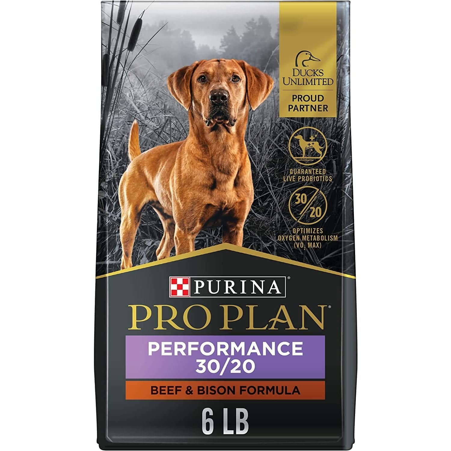 A bag of  Purina Performance 30/20 Beef & Bison Formula dog food, weighing 6 pounds. The packaging features gold and black design elements and the Purina logo on a grey background, along with a visual of outdoor scenery and graphical embellishments indicating a partnership with Ducks Unlimited.