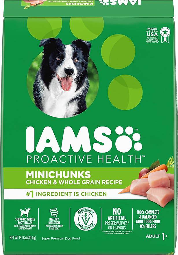 A bag of IAMS Proactive Health Minichunks dog food with chicken and whole grain recipe, featuring a happy black and white dog with its tongue out, and icons indicating no artificial preservatives or flavors, and 100% complete and balanced adult dog food for dogs aged 1 and above.