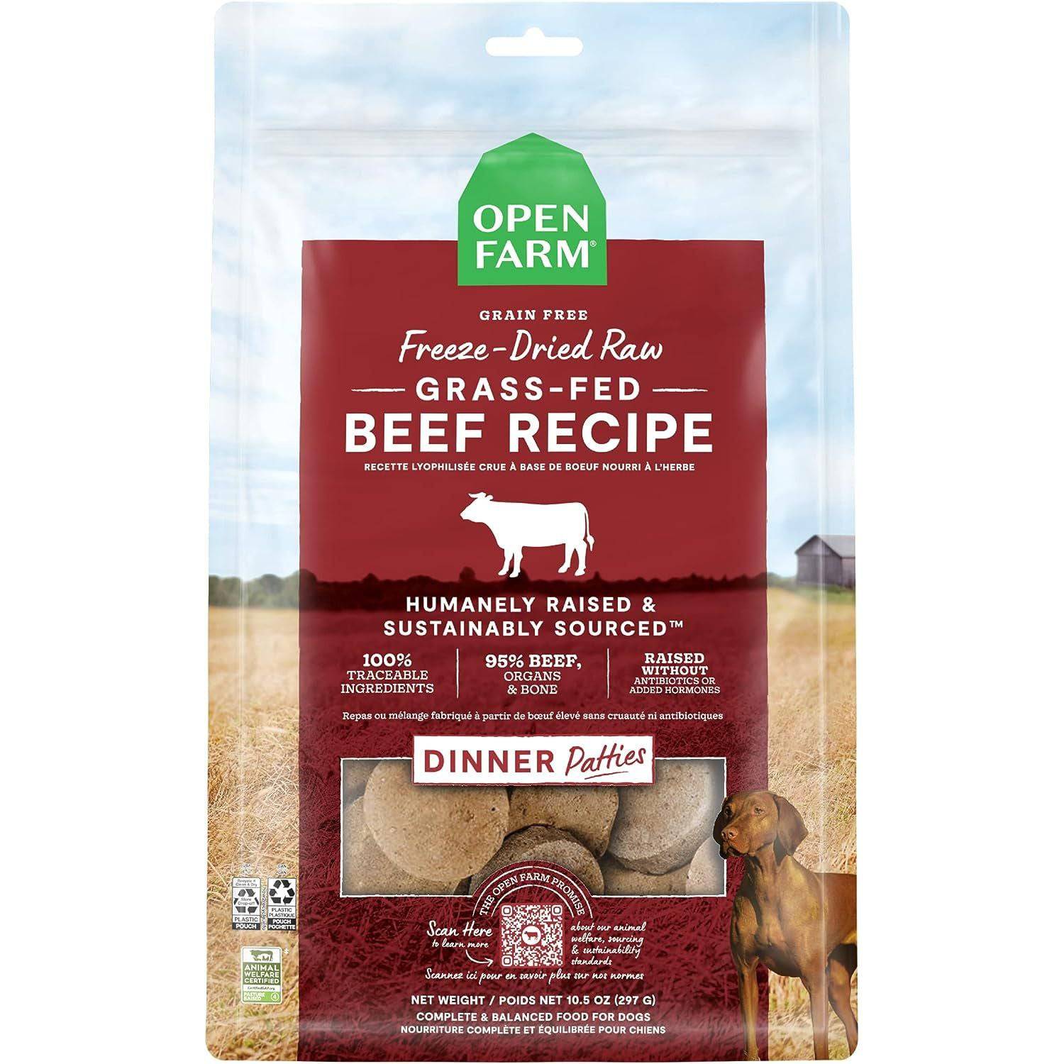 Package of Open Farm Freeze Dried Patties grain-free freeze-dried raw grass-fed beef recipe dog food, featuring a red and green design with an image of a cow, fields, and a dog. The package highlights the product as humanely raised, sustainably sourced, and contains 95% beef, organs, and bones.