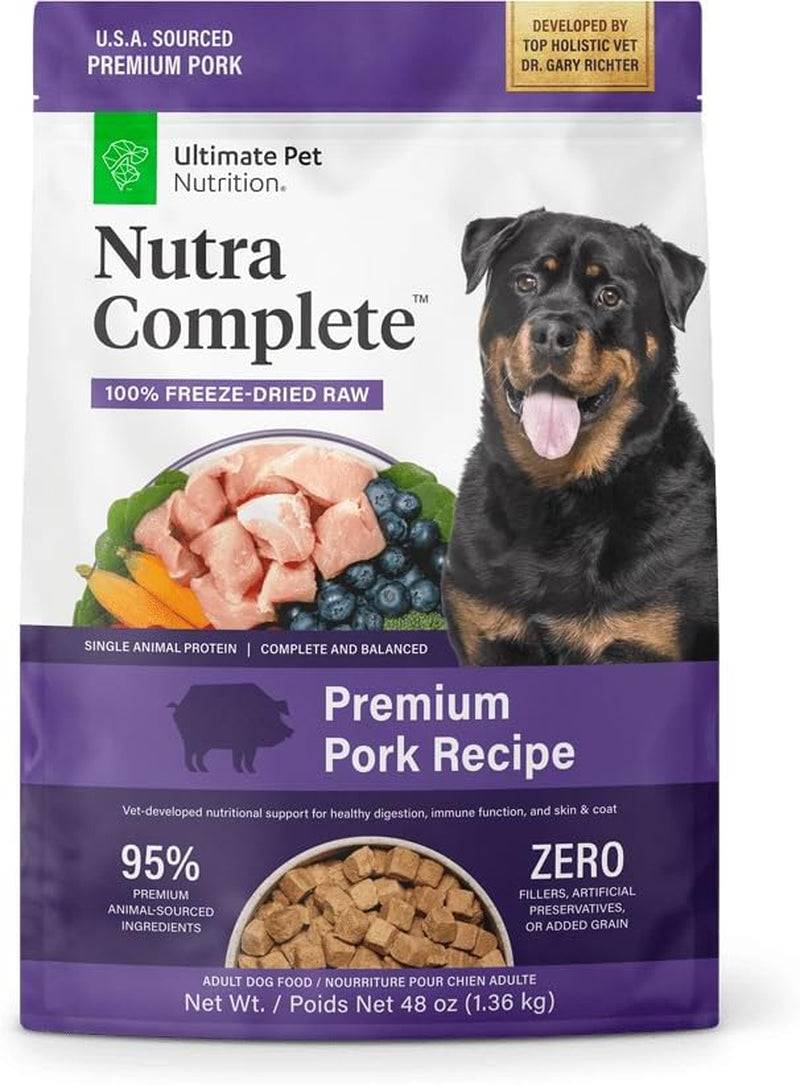 A bag of Nutra Complete premium pork recipe dry dog food with a picture of a Rottweiler on the front and a bowl of the kibble pictured at the bottom.