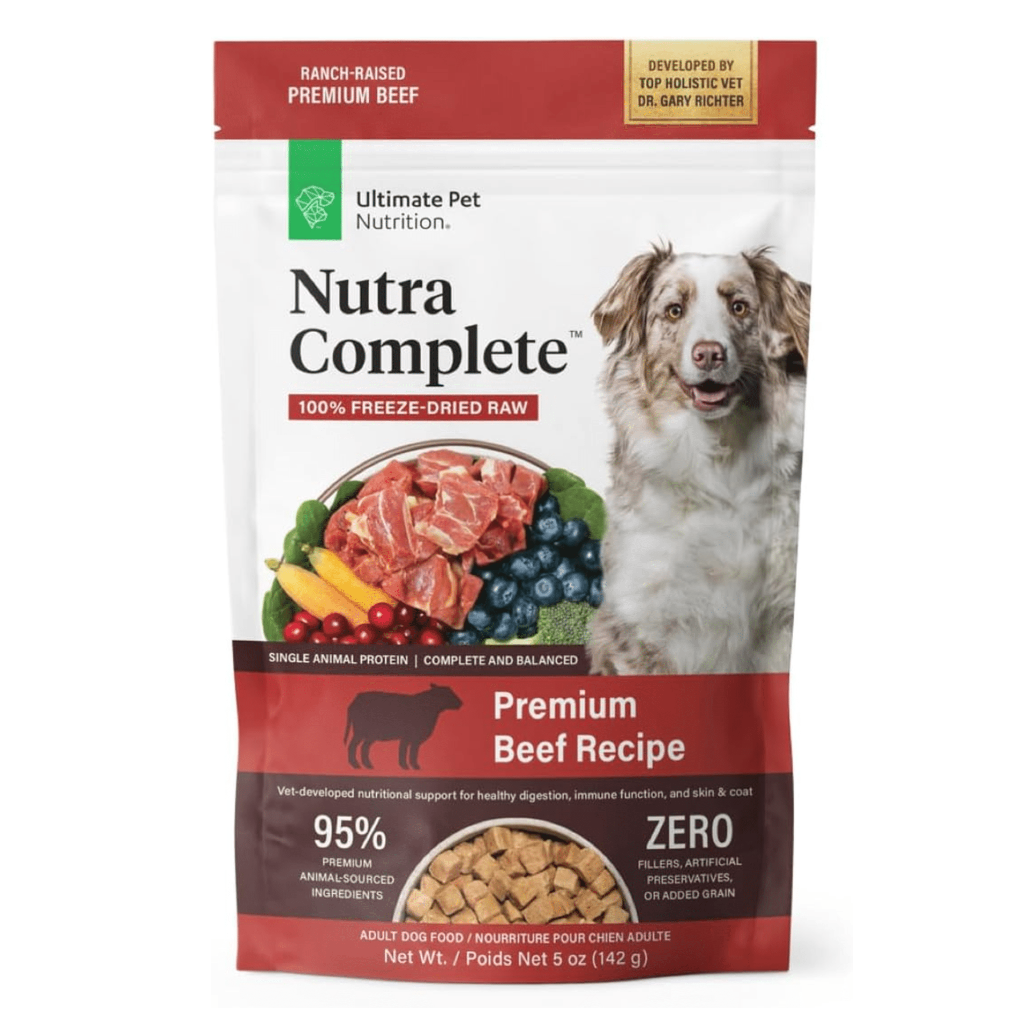 A package of Nutra Complete Ultimate Pet Nutrition freeze-dried raw beef dog food featuring the text "Premium Beef Recipe" and "95% premium animal-sourced ingredients," along with images of raw beef pieces, carrots, peas, and blueberries. The bottom of the package indicates it's a 5-ounce weight content and developed by top holistic vet Dr. Gary Richter. The packaging also states "Single Animal Protein | Complete and Balanced" with a red banner highlighting "Ranch-Raised Premium Beef."