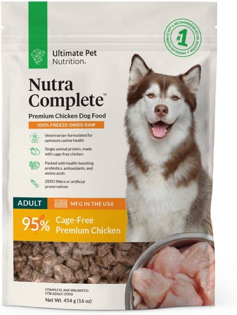 A bag of Ultimate Pet Nutra Complete premium chicken dog food with a Husky dog on the front and a bowl of raw chicken pieces at the bottom.