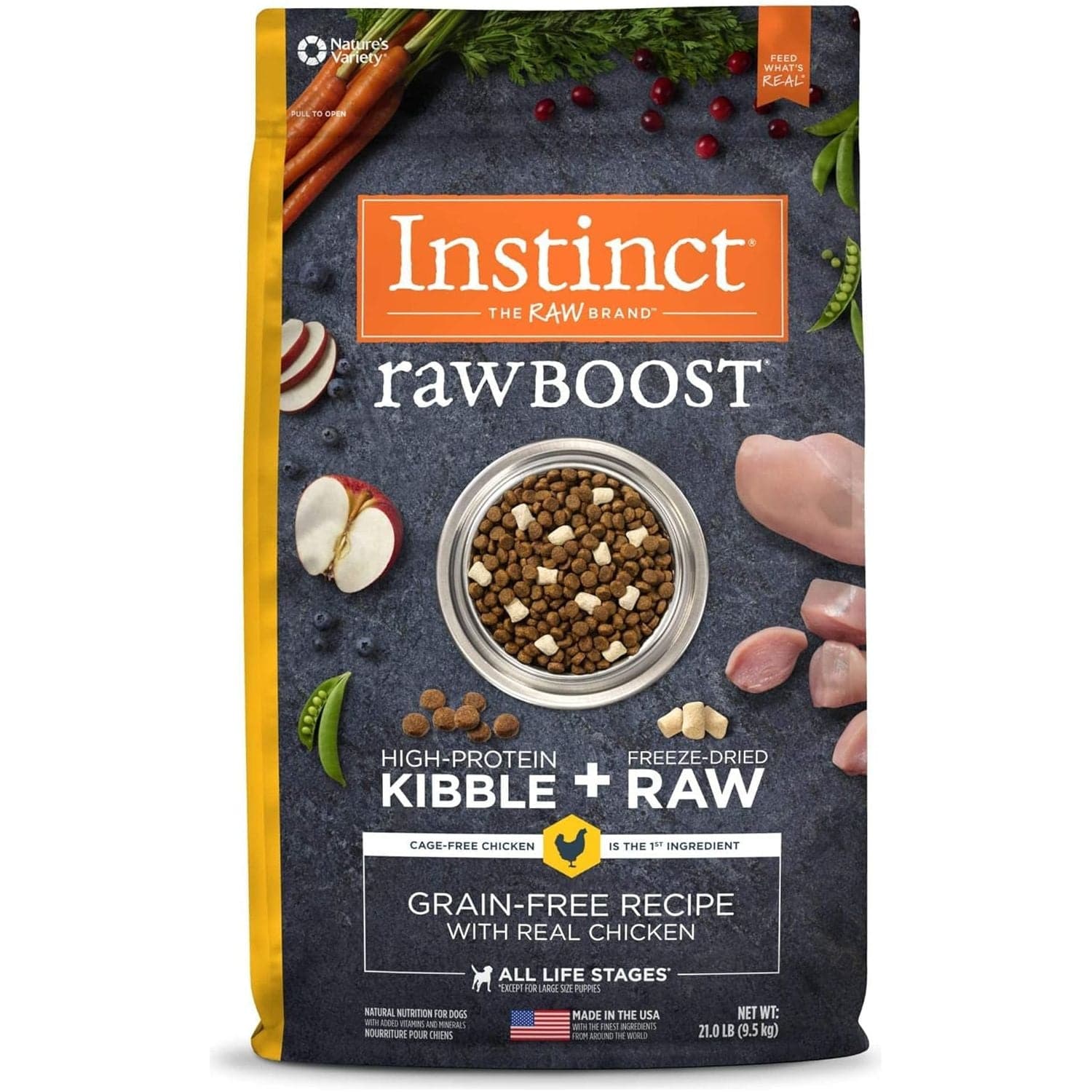 A package of Instinct Raw Boost high-protein dog food featuring kibble and freeze-dried raw chicken, highlighted by images of fresh vegetables, and a bowl of the dog food at the center. The package promotes a grain-free recipe, suitable for all life stages and made in the USA.