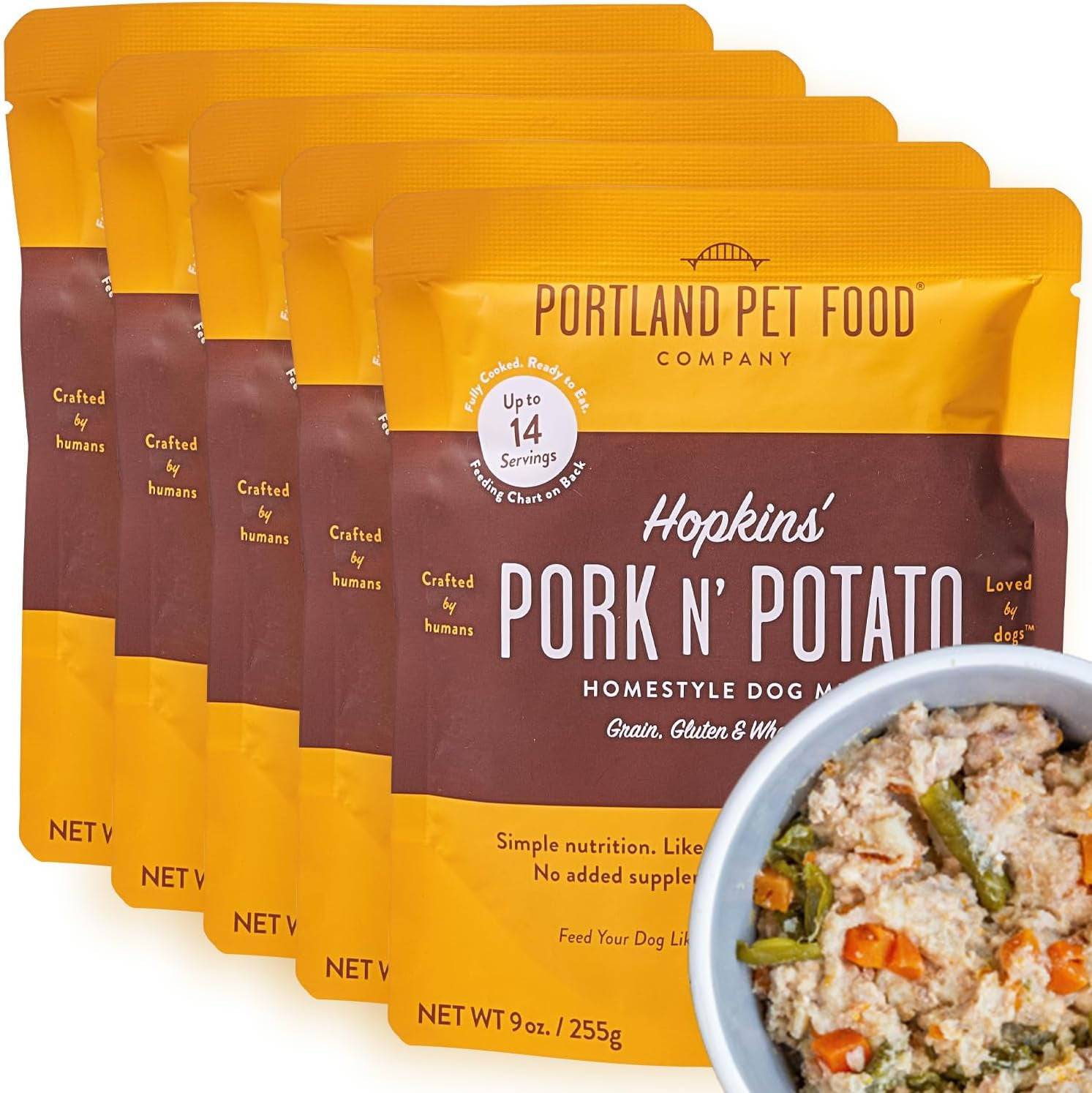 Front packaging of Portland Pet Food in multiple individual packs, featuring vibrant labels showcasing the wholesome ingredients within.